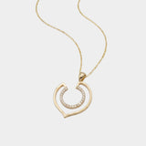 Yellow gold necklace with a geometric-shaped pendant on a white background