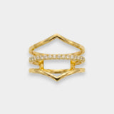 Gold ring with diamond accents on a light gray background