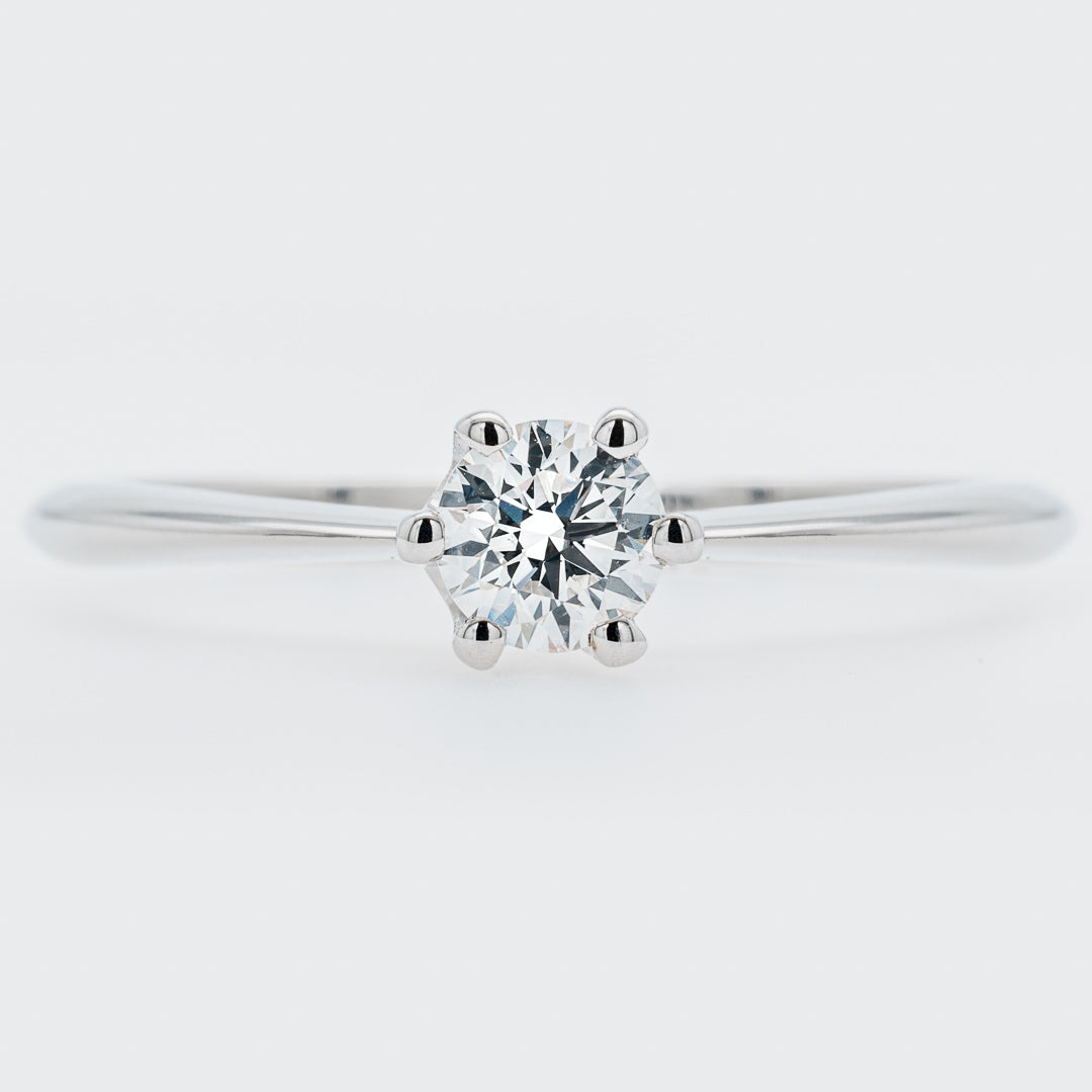 Diamond ring on a light gray background