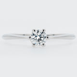 Diamond ring on a light gray background
