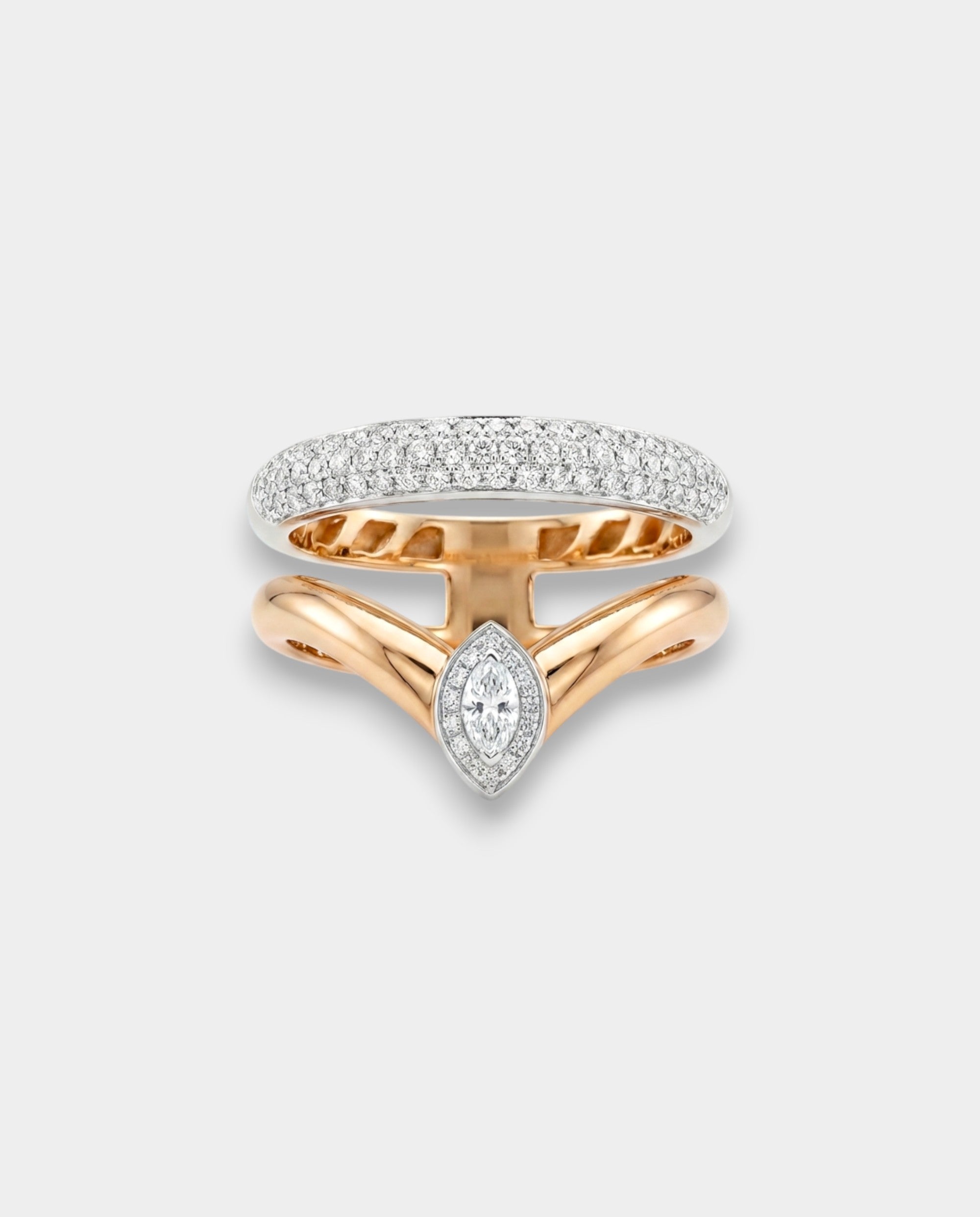 Bypass rings with diamond accents on a light gray background