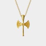 Gold axe-shaped pendant on a chain against a white background