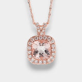 Rose gold necklace with a pink gemstone pendant on a light gray background