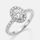 Diamond ring with a halo setting on a white background