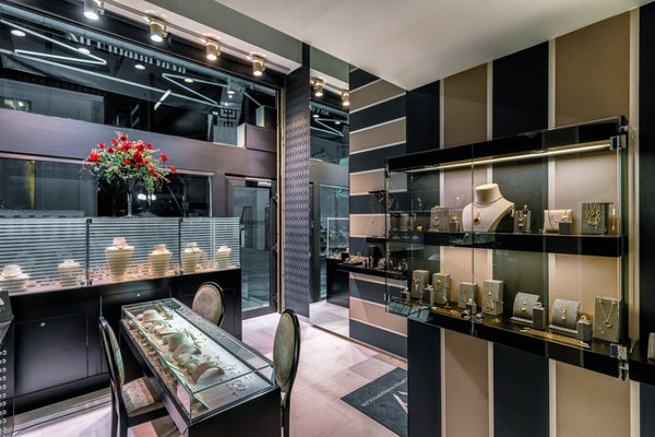 Luxury jewelry store interior with display cases and decorative elements.