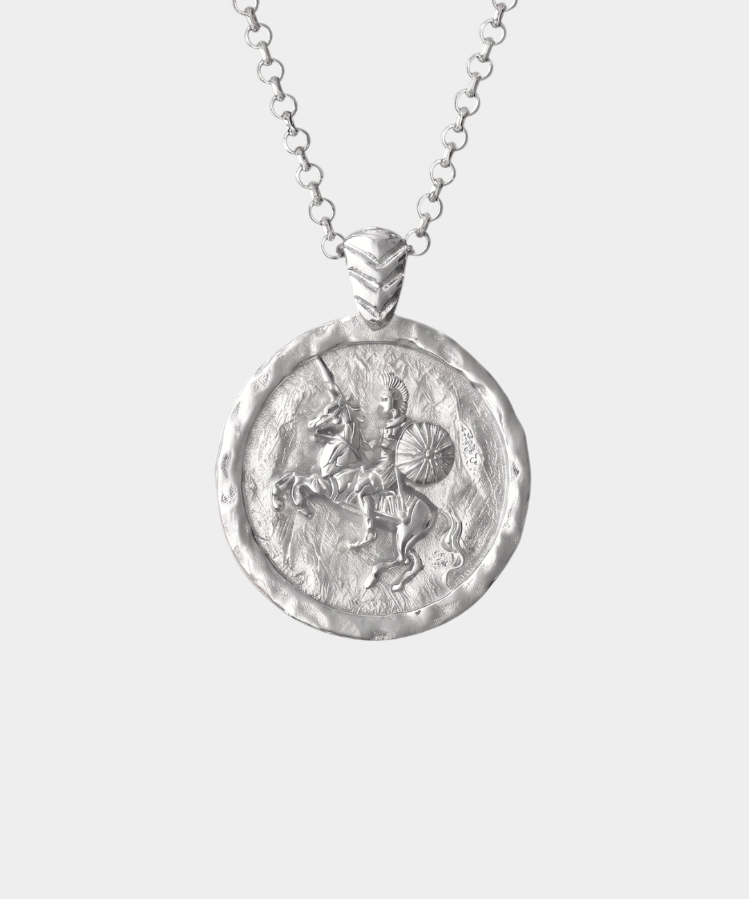 A silver medallion pendant necklace on a delicate silver chain, shown against a light gray background.