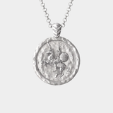 A silver medallion pendant necklace on a delicate silver chain, shown against a light gray background.