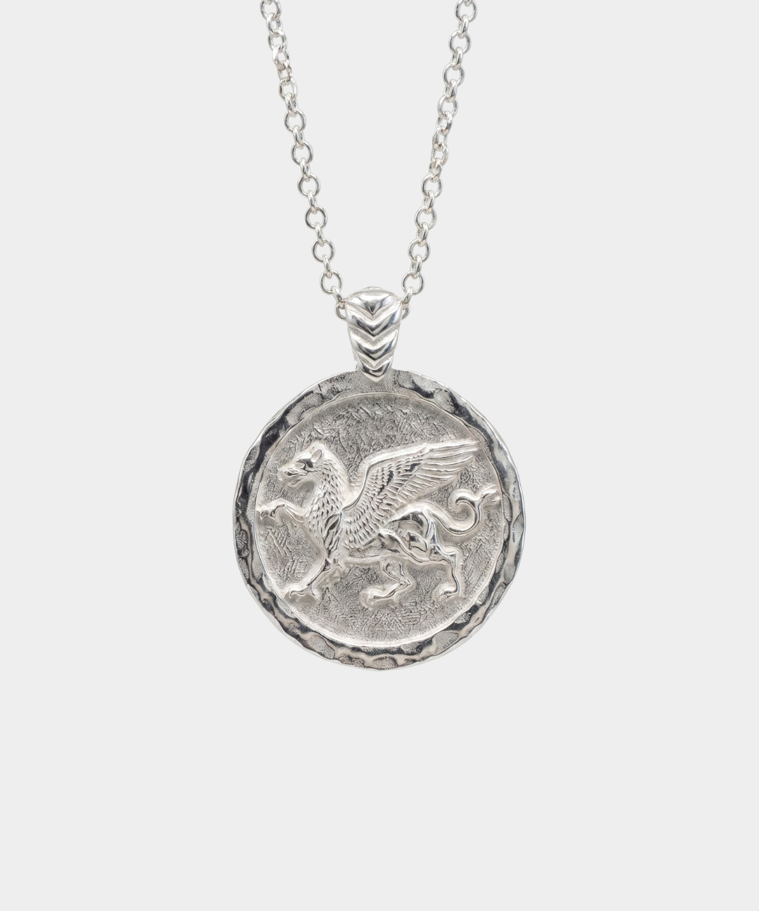 Silver necklace with a round pendant featuring a Griffin design on a white background