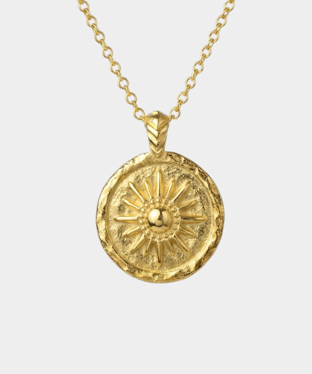Gold necklace with a sun-shaped pendant on a white background