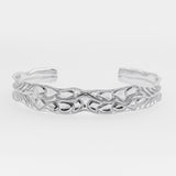 White gold bracelet on a light gray background