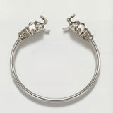 Silver elephant bracelet on a light gray background