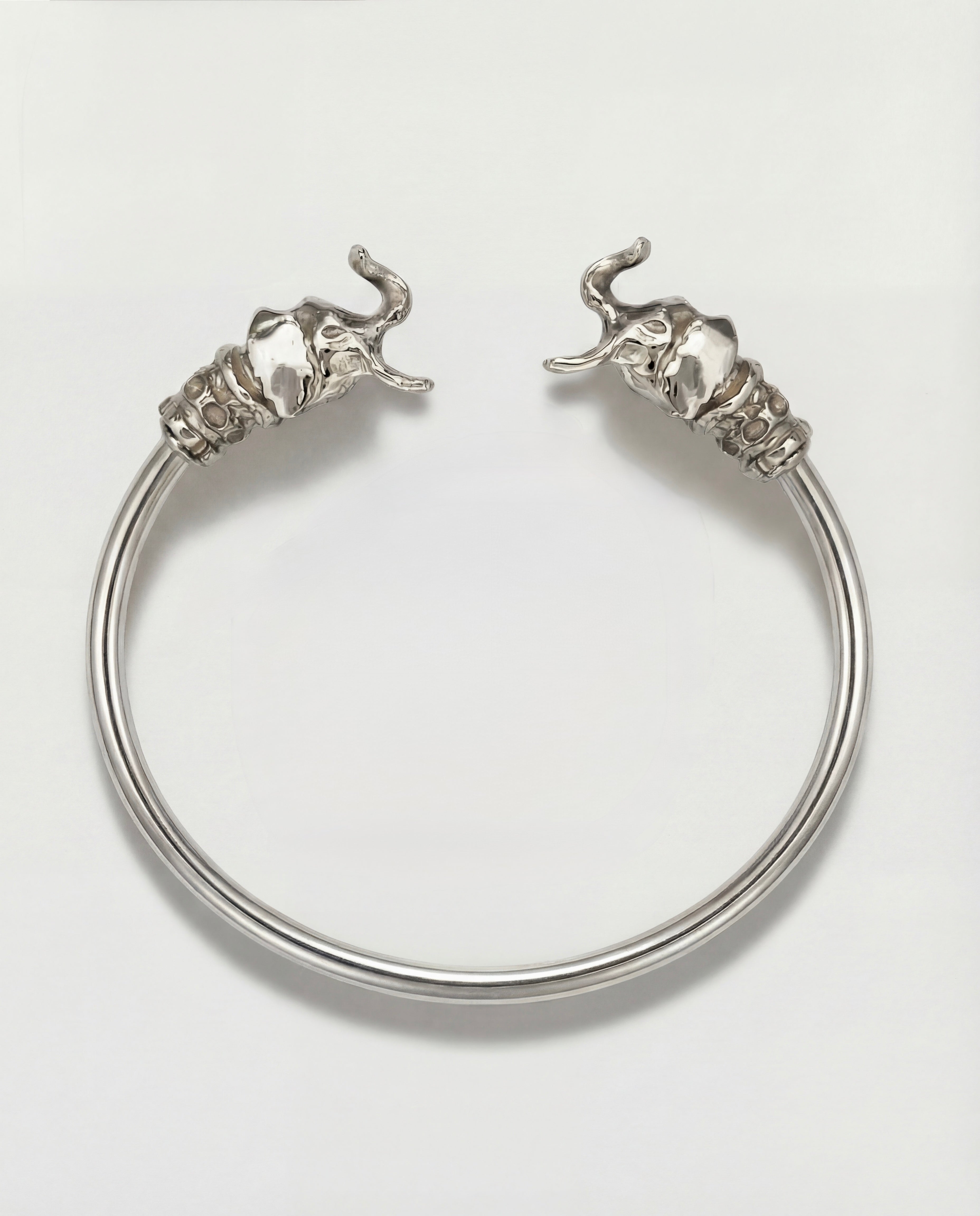 Silver elephant bracelet on a light gray background
