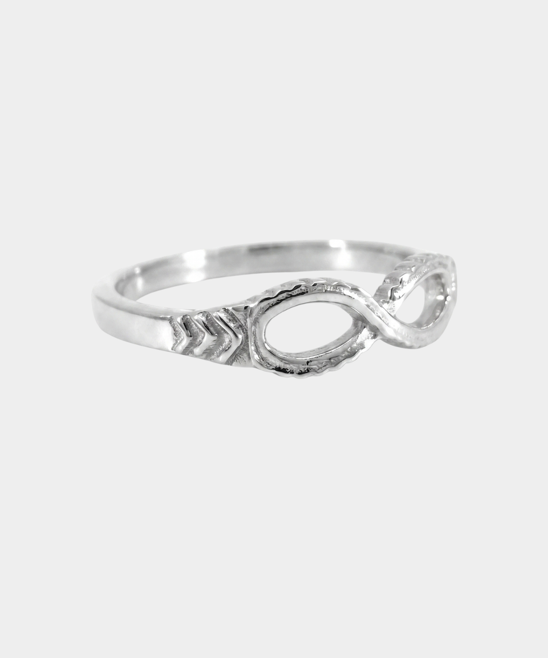 Silver ring with a unique design on a white background