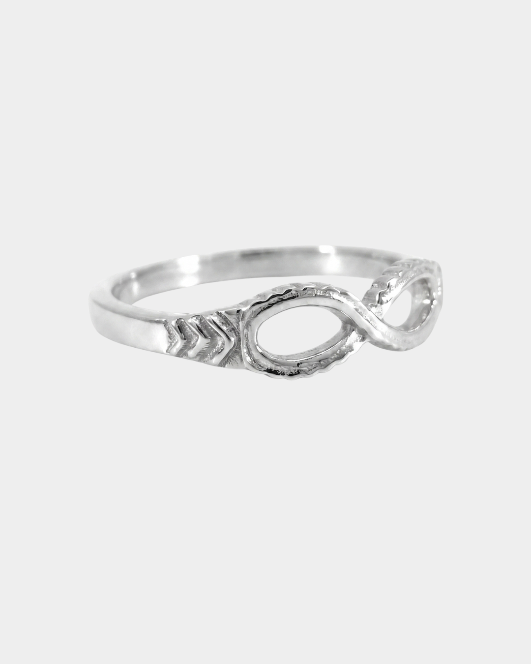 Silver ring with a unique design on a white background