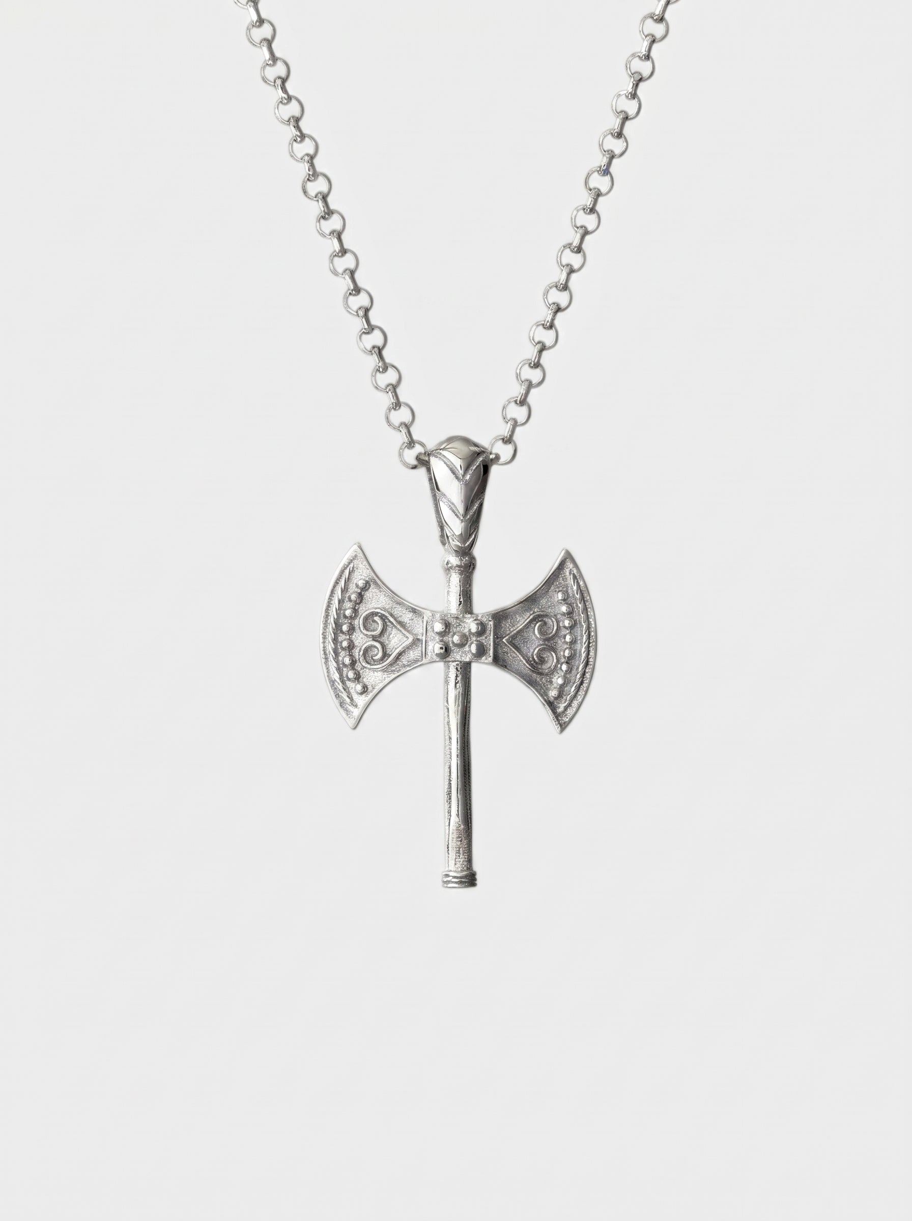 Silver axe-shaped pendant on a chain against a white background