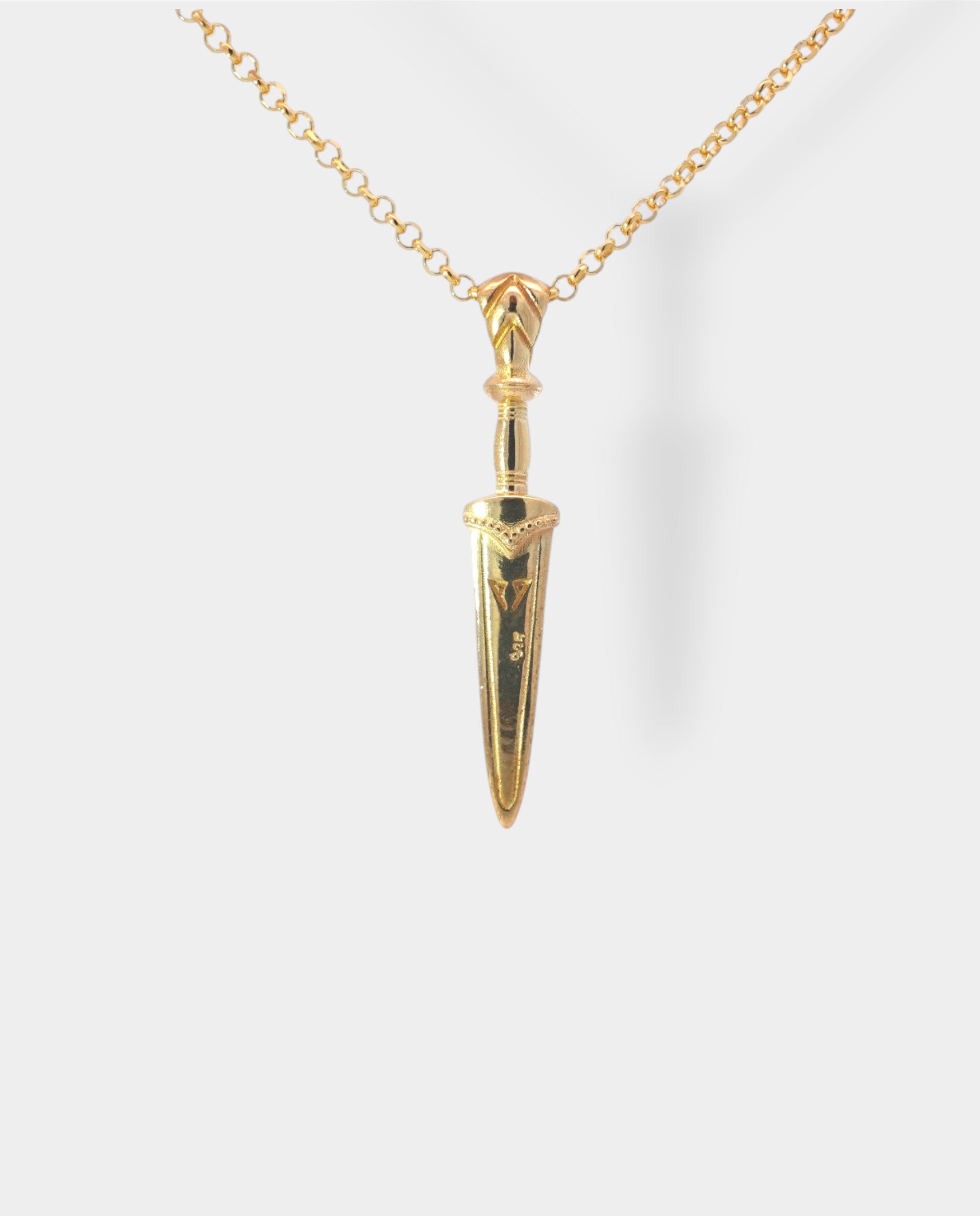 Gold necklace with a unique sword pendant on a white background