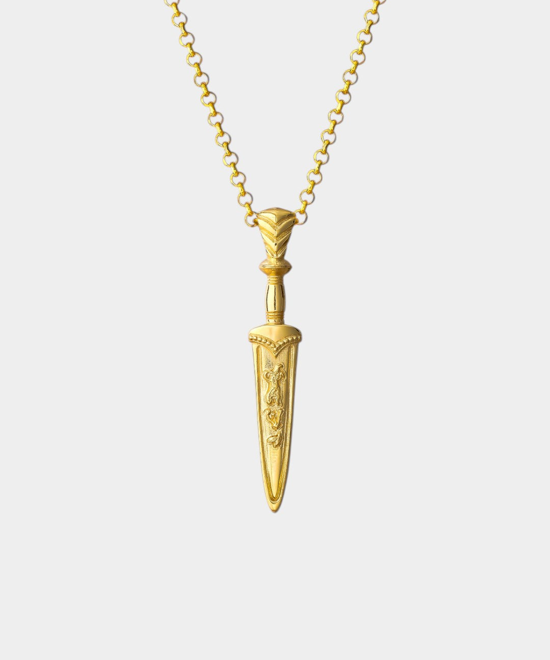 Gold dagger-shaped pendant necklace on a white background