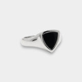 Silver ring with a black triangular stone on a white background