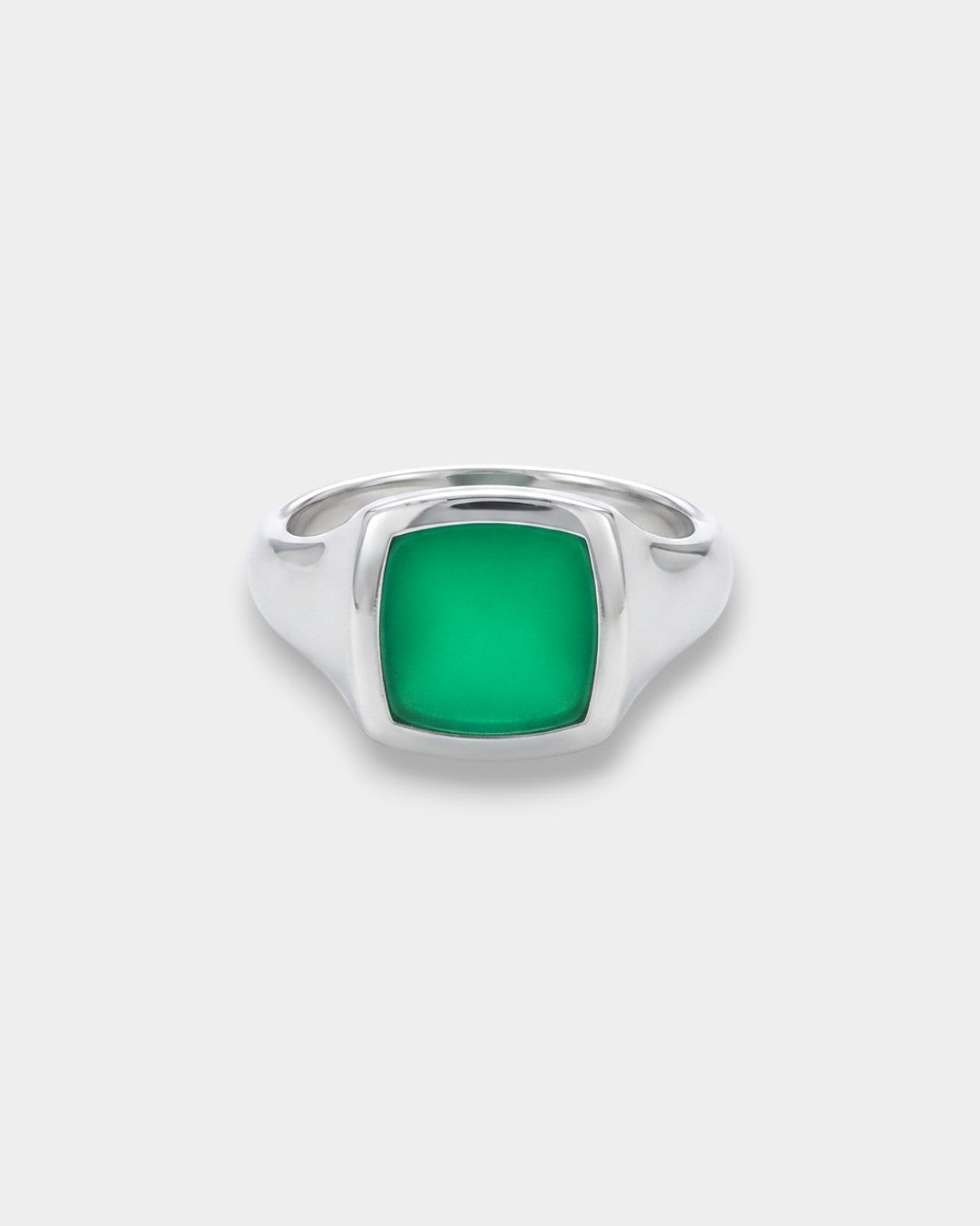 Silver ring with a green square stone on a white background