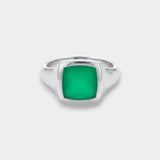 Silver ring with a green square stone on a white background
