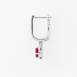 White gold hoop earring with a red ruby on a white background