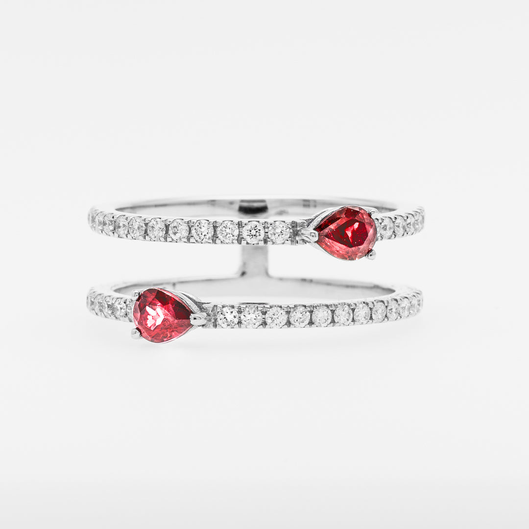 White gold rings with red rubies on a white background