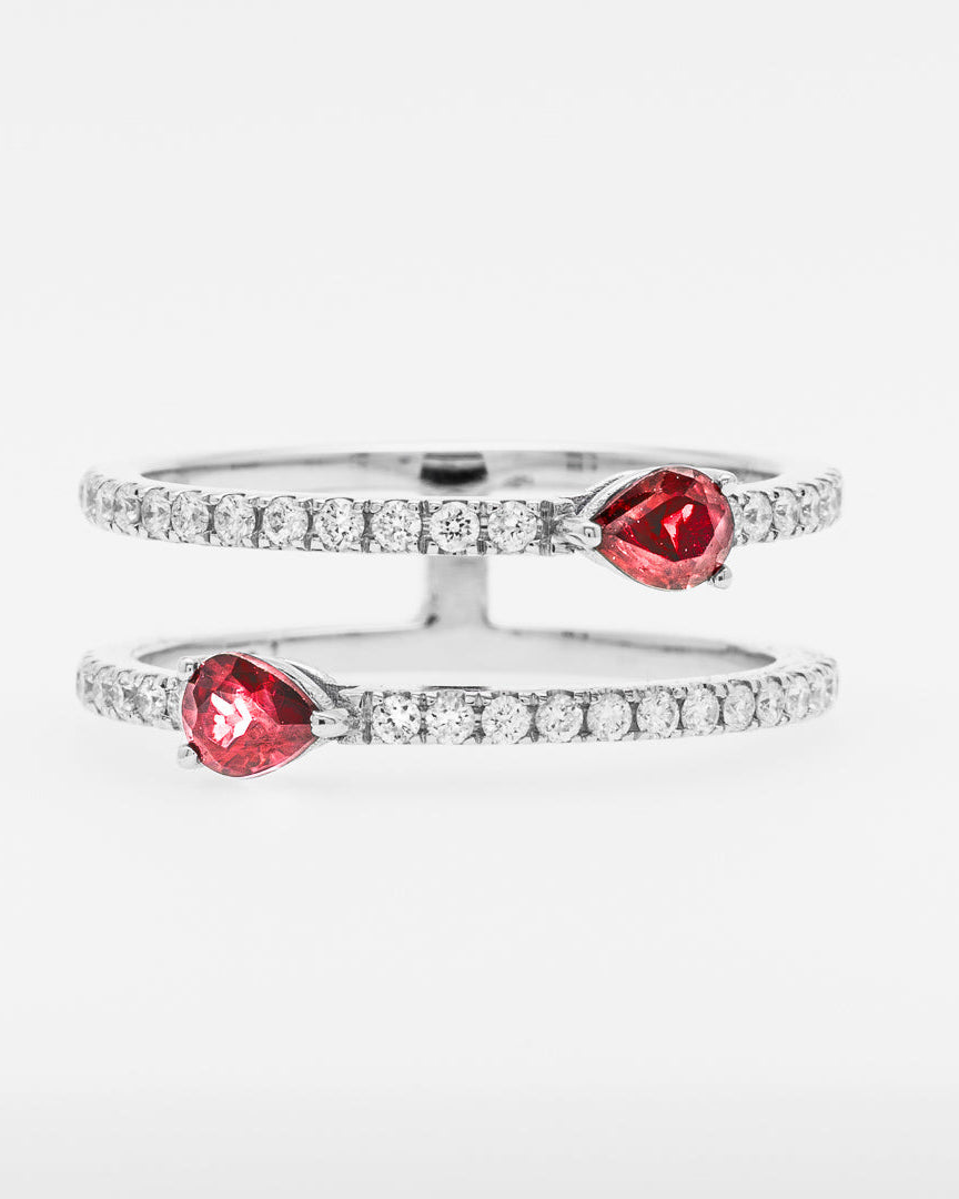 White gold rings with red rubies on a white background