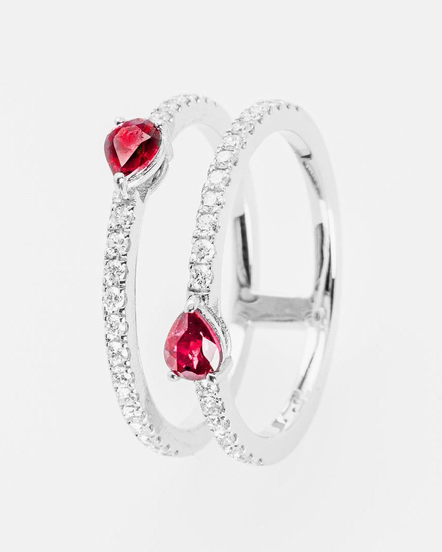Silver ring with rubies on a white background