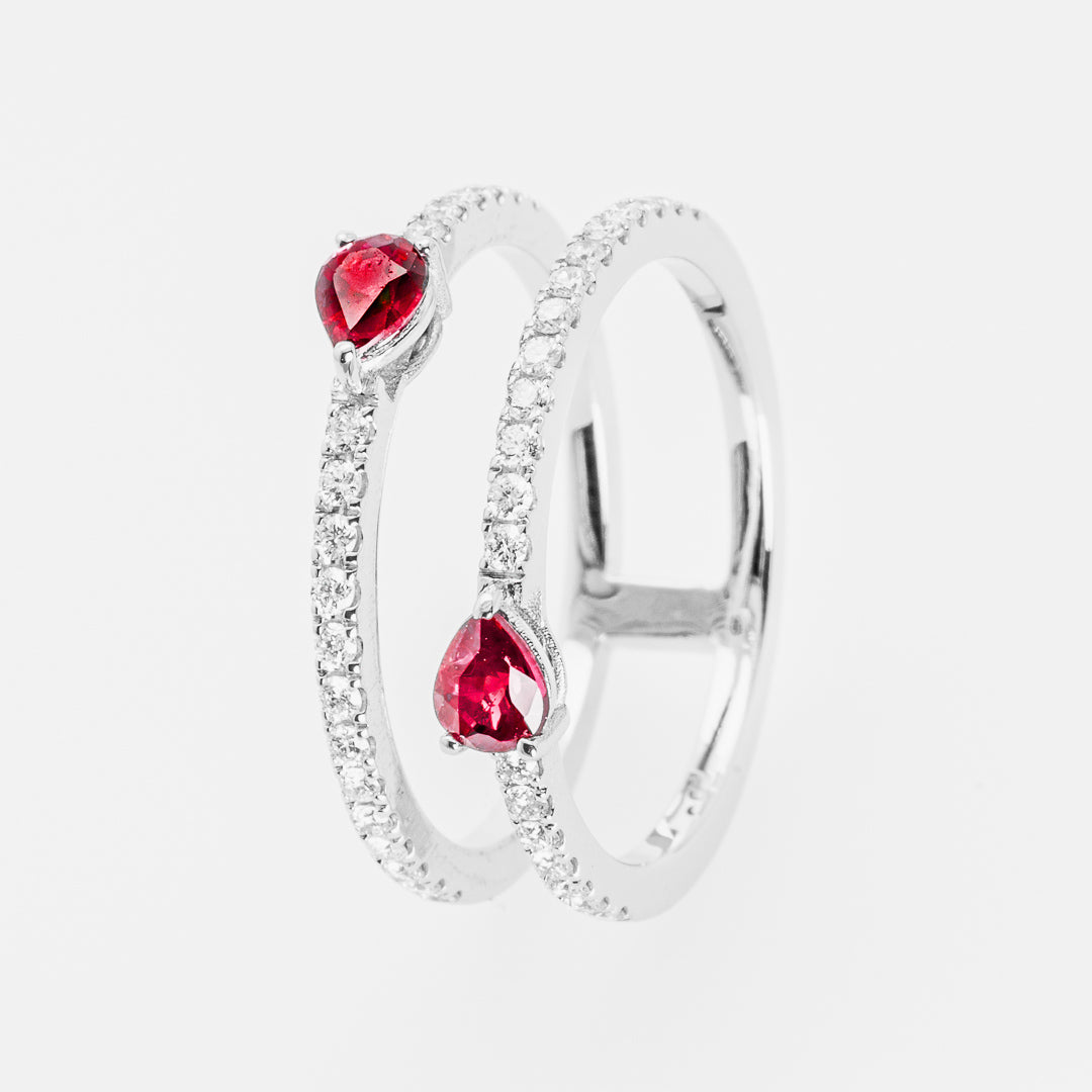 Silver ring with rubies on a white background