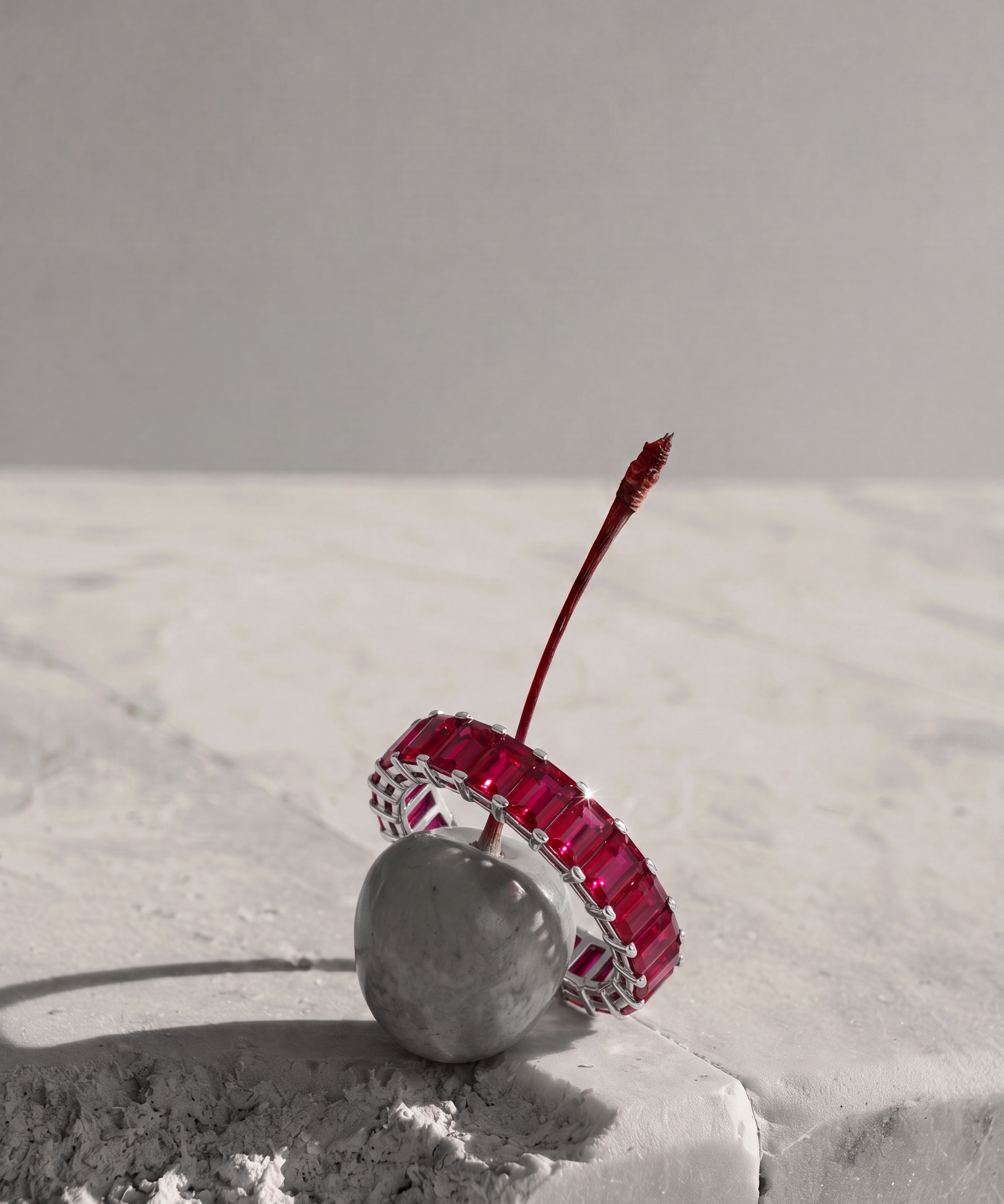 a ruby eternity ring on a cherry 