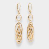 Gold hoop earrings on a light gray background