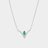 Necklace with a green gemstone pendant on a white background