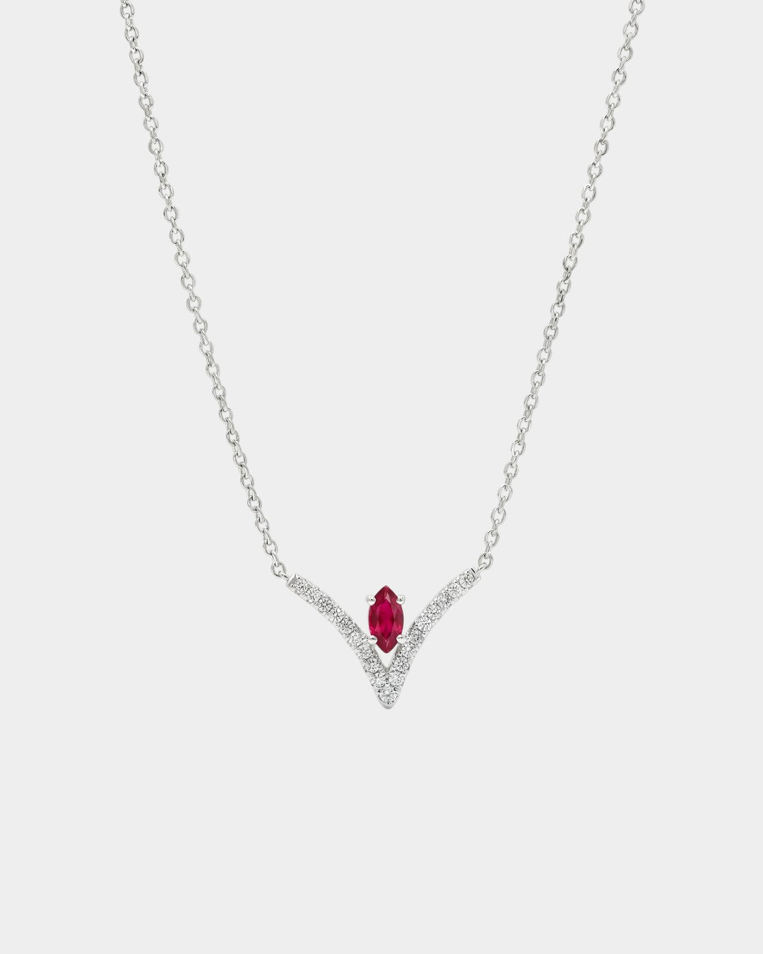 Necklace with a red gemstone and diamond accents on a white background