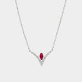Necklace with a red gemstone and diamond accents on a white background