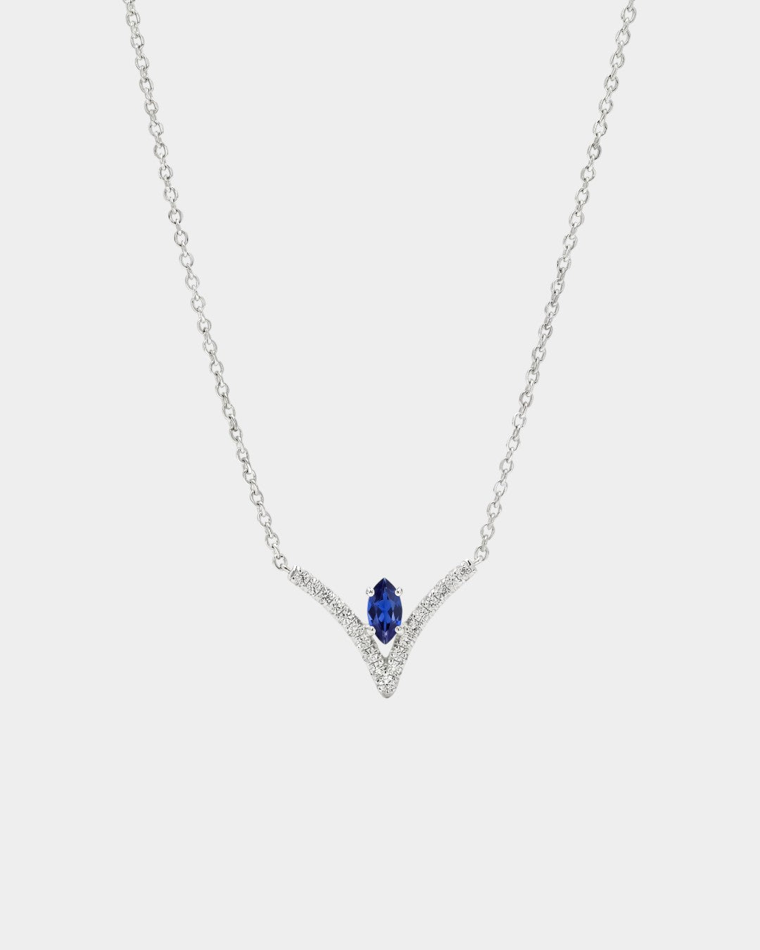 Necklace with a blue gemstone and diamond accents on a white background